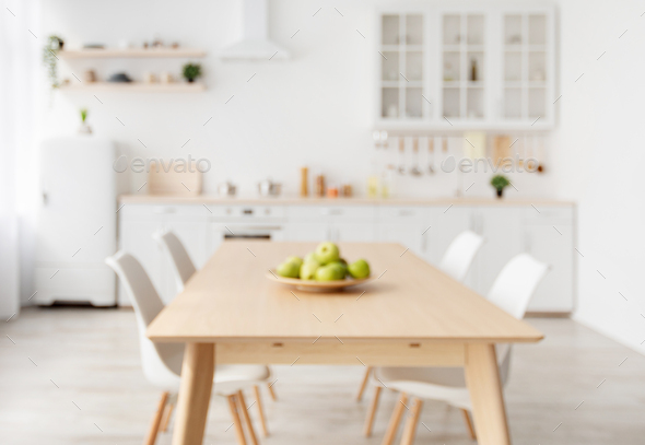 Blurred Background With Modern Light, Wood Dining Room Table With White Chairs