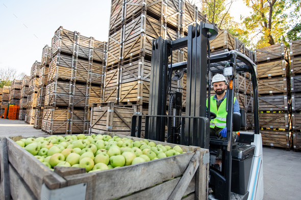 Fork lift truck loading boxes of fruit juice to the beverage storage of  fruit juice press company, Fruchtsaftkelterei Emila Jac Stock Photo - Alamy