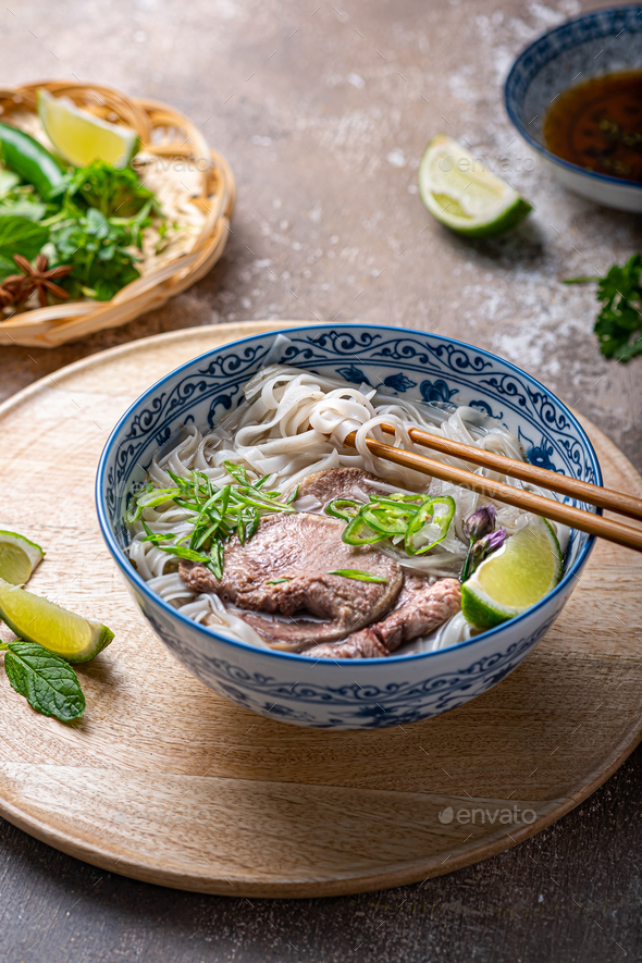 Rice noodles soup with beef and herbs, vietnamese cuisine Stock Photo