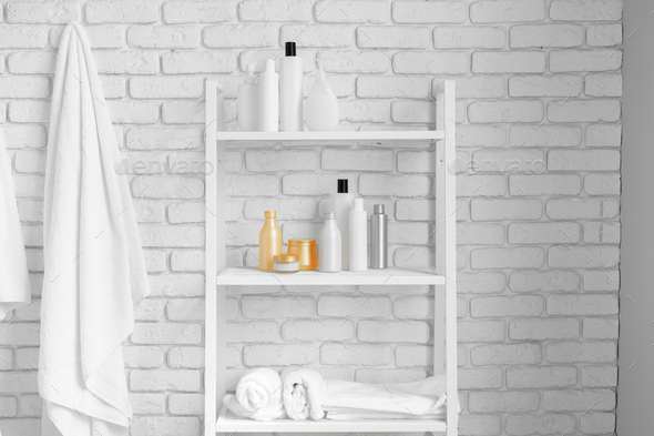 Hanging Towels Against White Brick Wall, How To Hang Shelves On Brick Wall