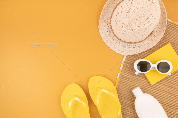 Flat lay with summer accessories for woman. Sun hat, sunglasses, sunscreen  protection, flip flops Stock Photo by OksaLy