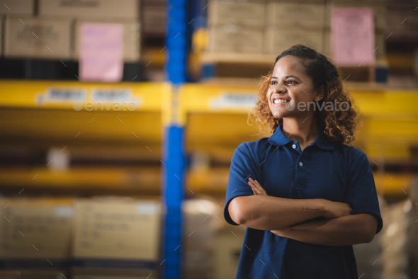 African American worker person working with safety in warehouse logistic factory - Stock Photo - Images