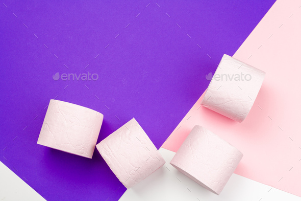 Pastel pink toilet paper on bright color block background Stock Photo by  FabrikaPhoto