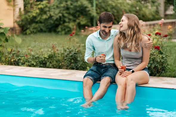 Couple drinking sparkling wine with strawberries - Stock Photo - Images