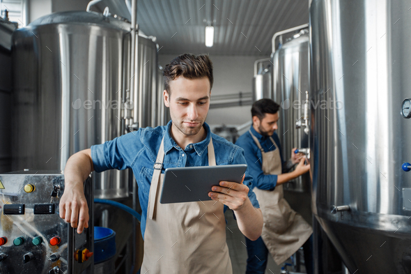 Smart factory, modern brewery management and craft beverage production - Stock Photo - Images