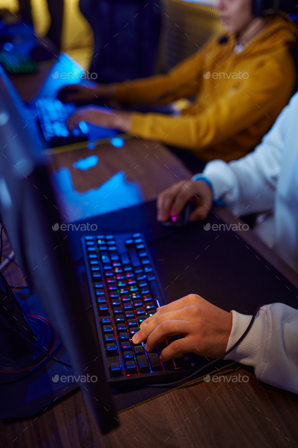 Two young gamers play in game club - Stock Photo - Images