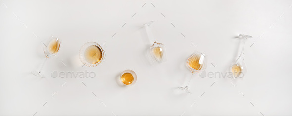 Flat-lay of trendy Orange or Amber wine in different glasses - Stock Photo - Images