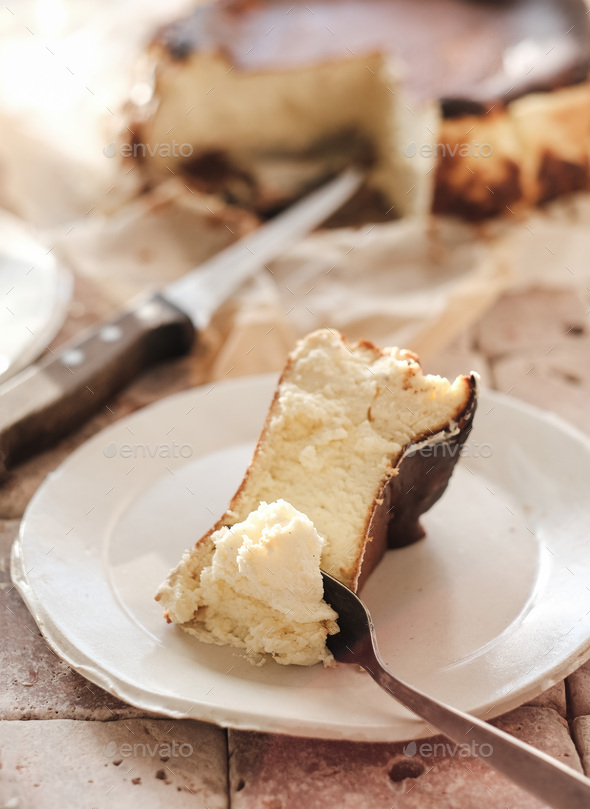 Piece of sweet Homemade San Sebastian burnt cheesecake - Stock Photo - Images