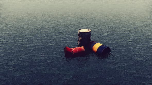 Old Rusty Barrels Oil in Sea Water Illustrates the Pollution of Environment alt