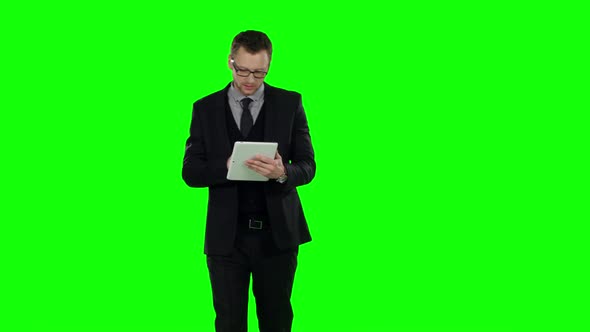 Business Man Makes Online Shopping . Green Screen. alt
