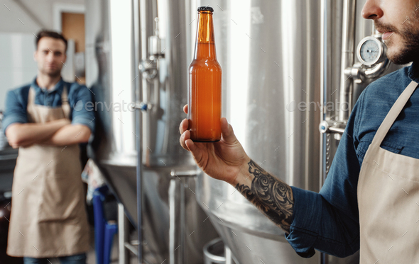 Fresh craft beer, quality control of ready to sell alcoholic beverage - Stock Photo - Images