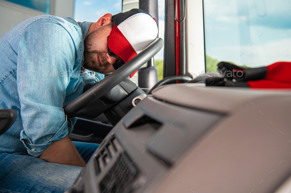 Semi Truck Driver Sleeping on the Steering Wheel - Stock Photo - Images