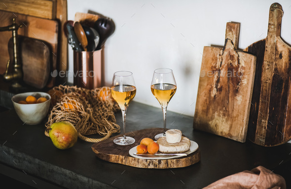 Two glasses of Orange or Amber wine and appetizers - Stock Photo - Images