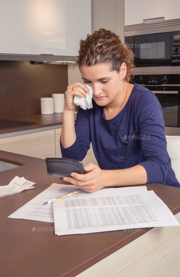 Unemployed woman with debts review monthly bills