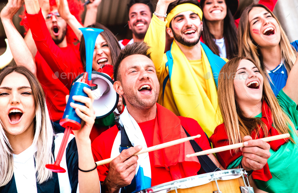 Football supporter fans cheering with drums watching soccer cup match - Stock Photo - Images