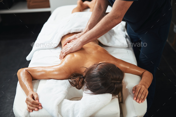 Female Back Massage - Vertical Stock Photo - Image of brunette