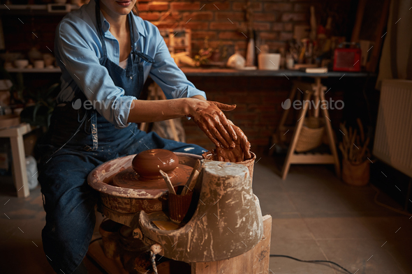 Creative, pottery and design with hands of woman in workshop