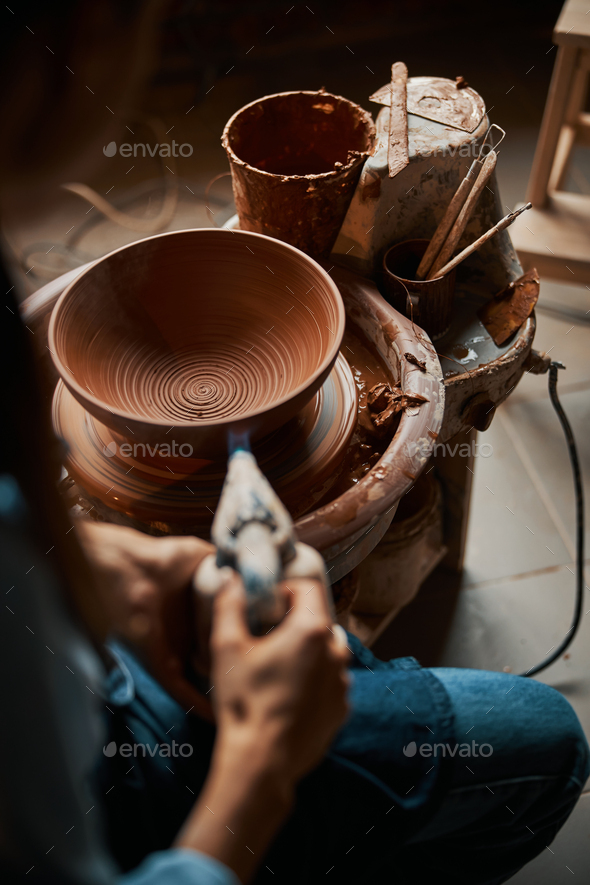 Creative, pottery and design with hands of woman in workshop