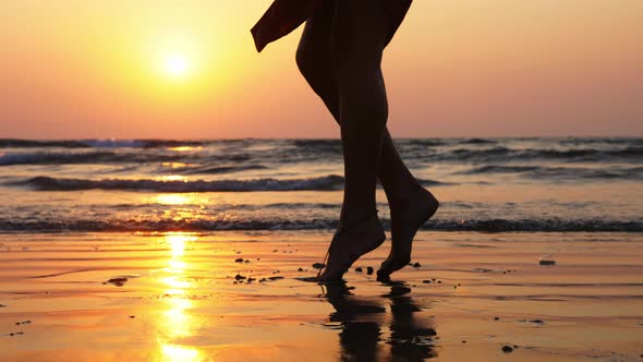 Silhouette Feet of Young Girl Dancing at Sunset in Slow Motion alt