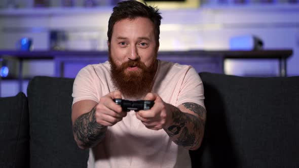 Man relaxing and playing video games