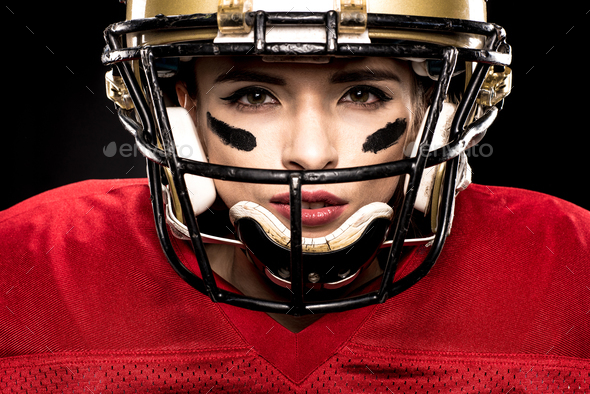 Close up portrait of female american football player in sportswear