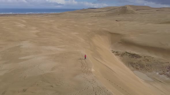 Walking on sand dunes in New Zealand