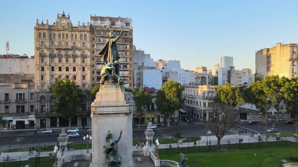 Aerial orbit of Monument of Two Congresses in Congressional Plaza surrounded by Balvanera buildings alt