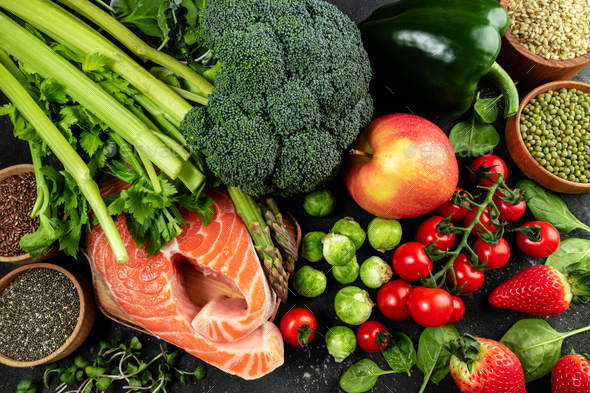Variety of healthy food. Selection of healthy eating fish, vegetables, fruits and berries