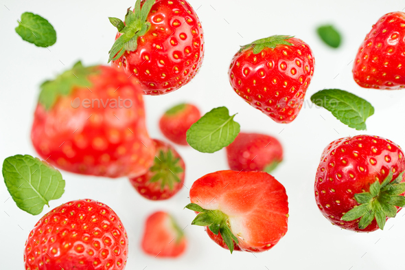 Falling berries strawberry on white background. Flying berries pattern. Background of strawberry