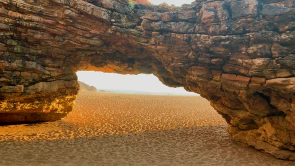 Cave on the northern beach Nazare, Portugal. alt