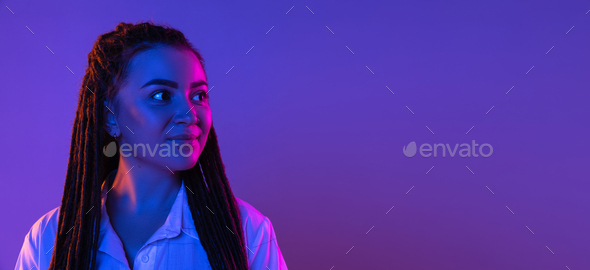 Young woman's portrait on gradient colors studio background in neon. Concept of human emotions - Stock Photo - Images