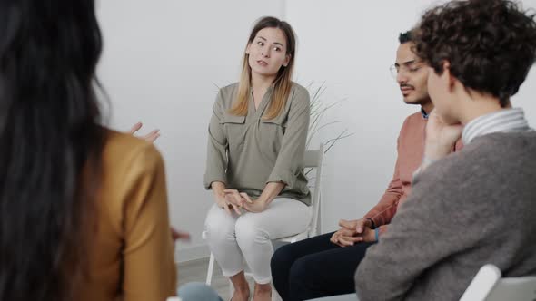 Crazy Woman Speaking to Group of People During Rehab Meeting Sharing Problems alt