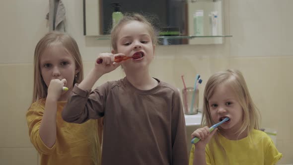 Children Brush Their Teeth