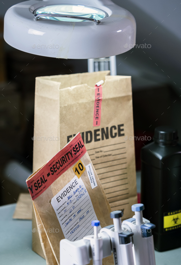Files and evidence bag in a crime lab, conceptual image