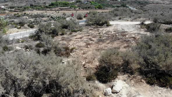 Aerial view of the areas stricken by water shortage near the Popeye village in Malta; deserted dry l alt