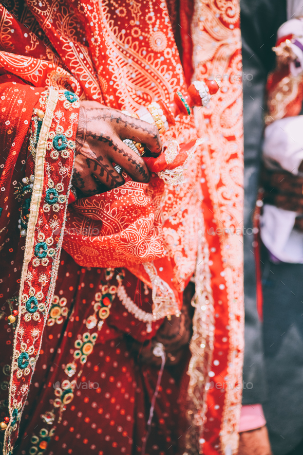 cropped shot of person in traditional festive clothes holding prayer wheel, Indian Himalayas,