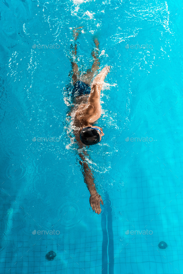 top view of young professional swimmer in competition swimming pool