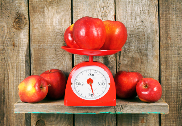 Apples on scales Stock Photo by Artem_ka