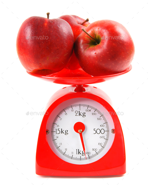 Apples on scales Stock Photo by Artem_ka