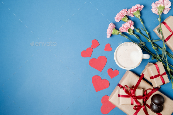 Morning breakfast for Valentines day. Coffee, chocolate candies, gift boxes, paper heart - Stock Photo - Images