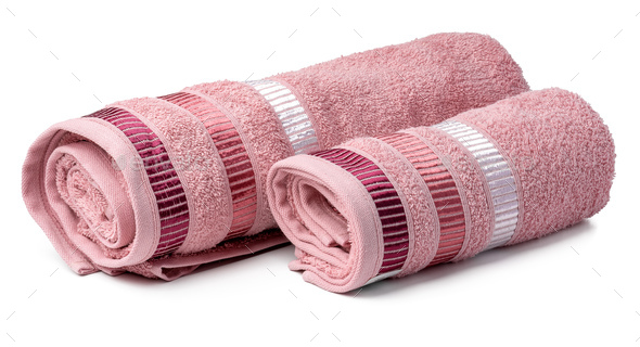 Stacked clean fluffy towels in a bathroom Stock Photo by FabrikaPhoto