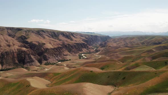 Mountain peaks and grassland alt