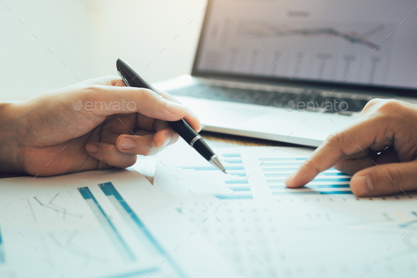 accounting staff of the company are jointly analyzing the graph of the expenses
