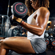 Young sportswoman doing the upper body workout Stock Photo by Iakobchuk