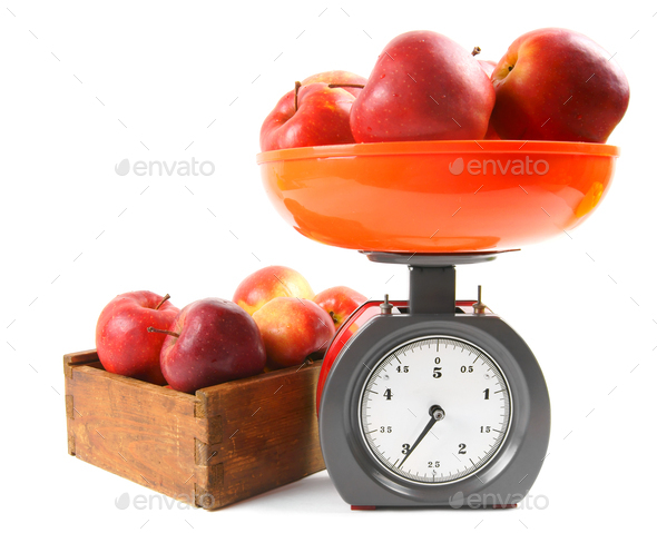 Kitchen scale weighting apples, Stock image