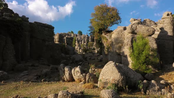 Landscape with Picturesque Rock Formations and Blue Sky in the Background alt