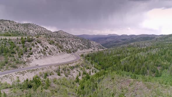 Aerial view lowering down to see damage from EF-2 tornado in Duchesne County alt