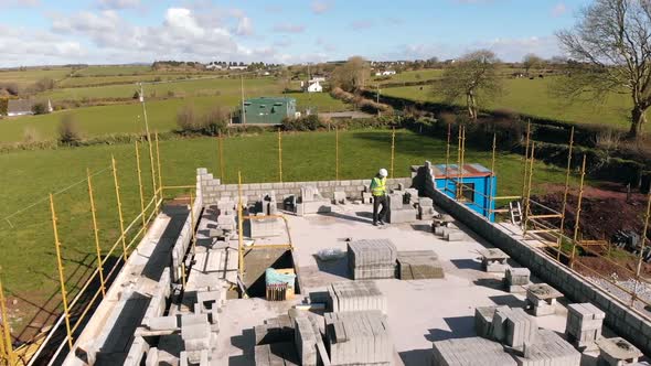 Male engineer inspecting the work at construction site 4k alt