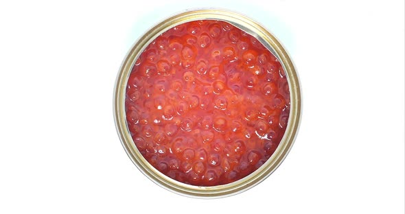 An Open Can With Red Caviar Rotates in a Circle, Close-up Shot of a Top View. Concept of Healthy alt