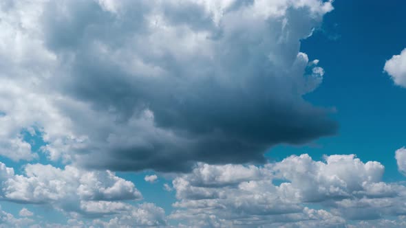Timelapse of Light White Puffy Clouds Moving in the Blue Sky Cloud Space alt
